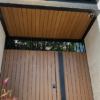 panel cladding wpc exterior quality outdoor instalado en puerta peatonal principal acabado co extruido hdpe duradero y sin mantenimiento