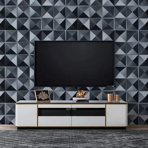 panel 3d de pvc decorativo negro para muro de tv modelo riverside tekno step instalado como fondo audiovisual, mejora imagen y reduce eco